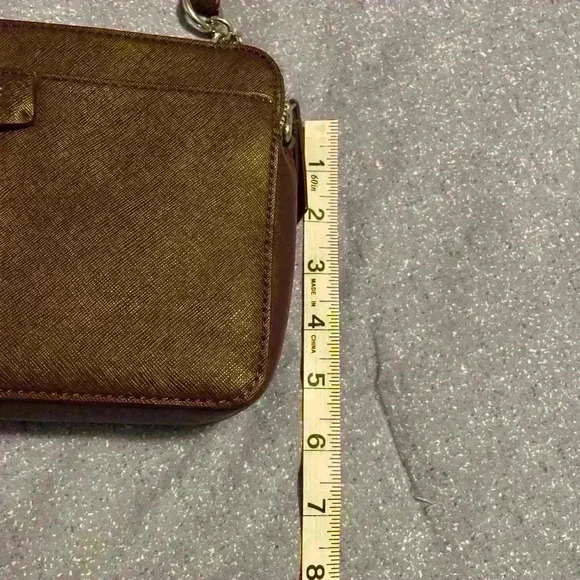 Nine West Crossbody brown with silver hardware. Snap closure and zipper pockets. - Picture 4 of 11